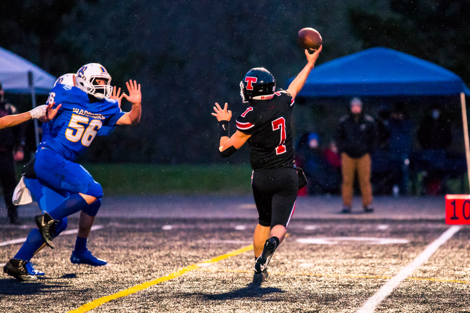 Tenino's Kysen Knox (7) throws to the end zone during a game against Rochester Friday night.