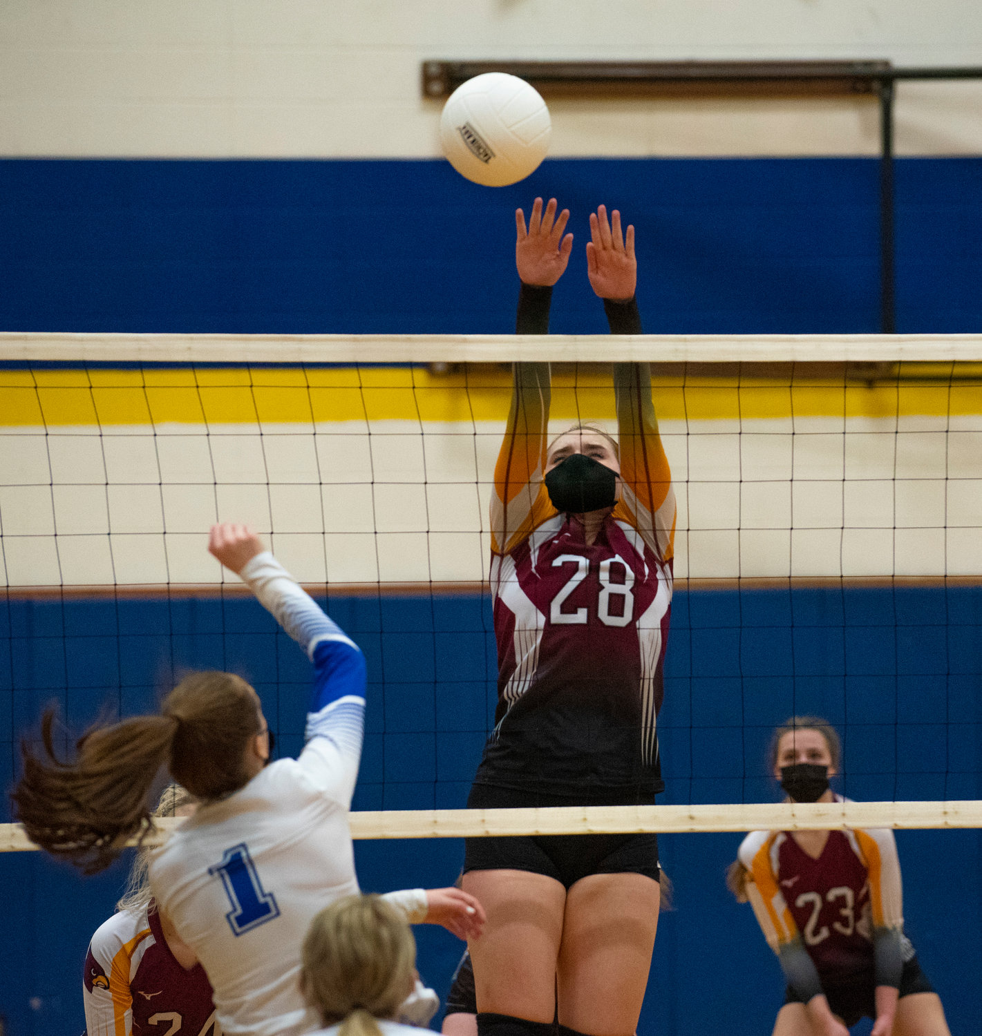 Winlock junior Madison Vigre (28) goes for a block against Toutle Lake on Saturday.