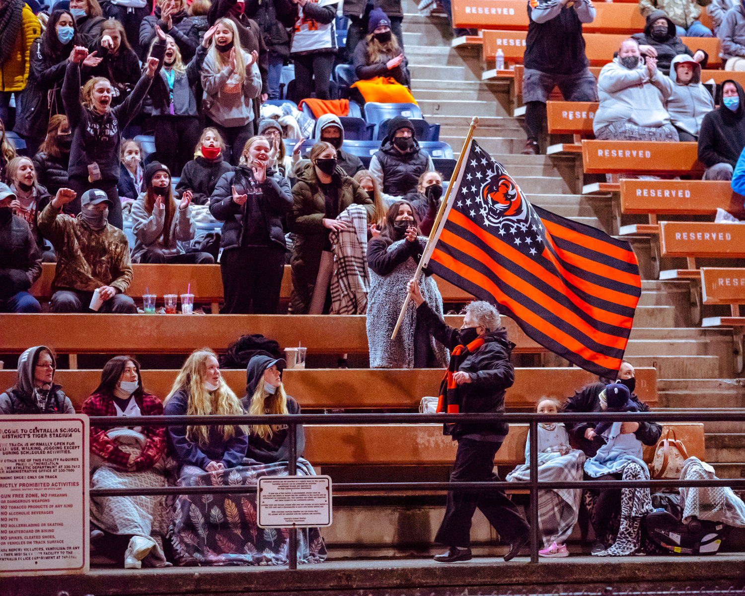 A flag is waved by Napavine fans during a game Saturday night at Tiger Stadium.