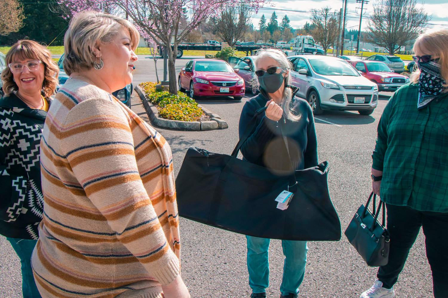 Barbara Kerschner holds a duffle bag similar to ones received through grant money to send with kids to their new homes Tuesday afternoon outside the Children and Family Services office in Centralia.