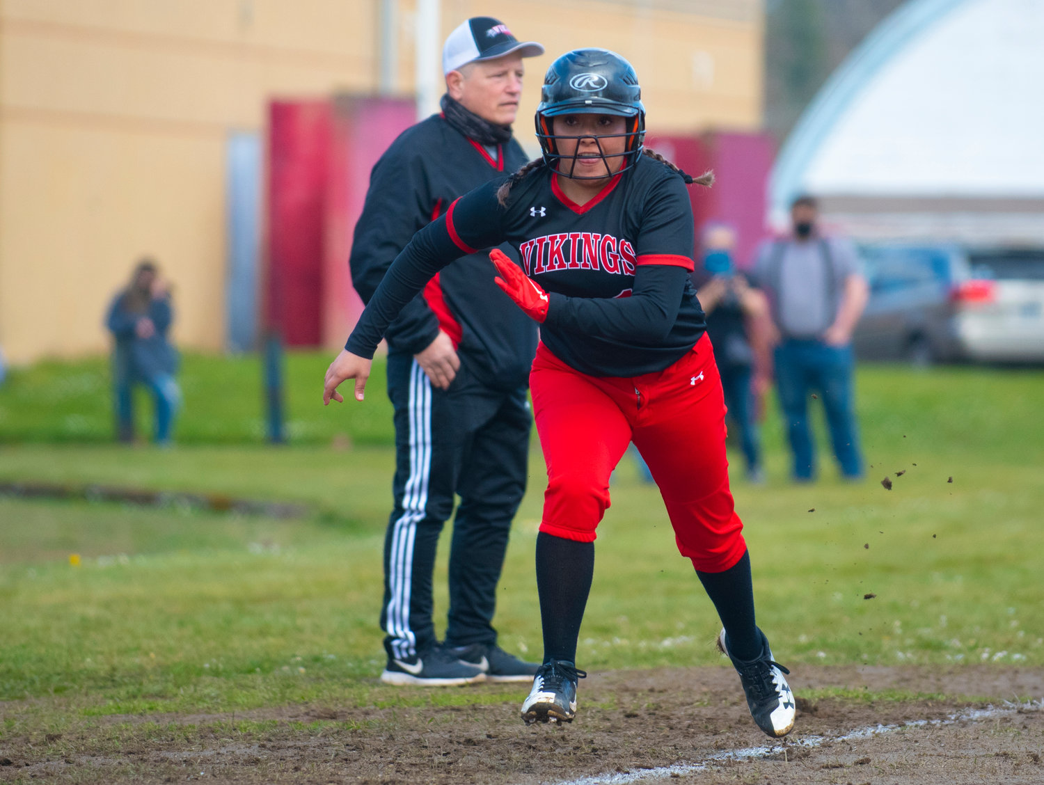A. Rueda bolts for home plate during Mossyrock's match against Oakville on Thursday.