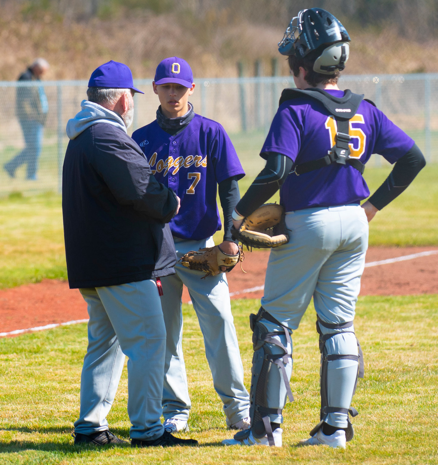 Onalaska pitcher Domanic Serl (7) has a mid-inning talk with his coach and catcher, Lane Zandell (15), on Friday at home.