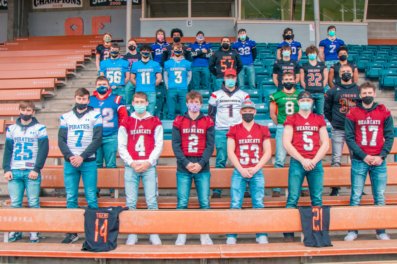 Athletes chosen for the All-Area Football Team pose for a photo at Tiger Stadium sporting their school’s football jerseys. Centralia jerseys draped over the seats in front were Benito Valencia (14) and Santos Lafferty (21), who were unable to attend the photo shoot.