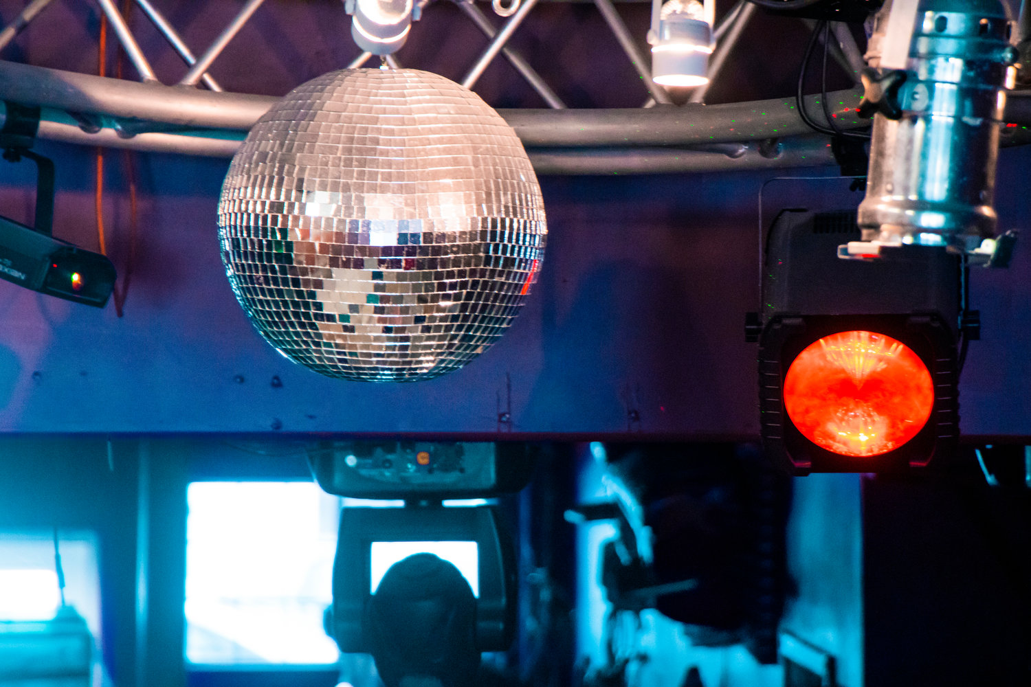 A disco ball and lights hang from the ceiling inside Insert Coin in Centralia.