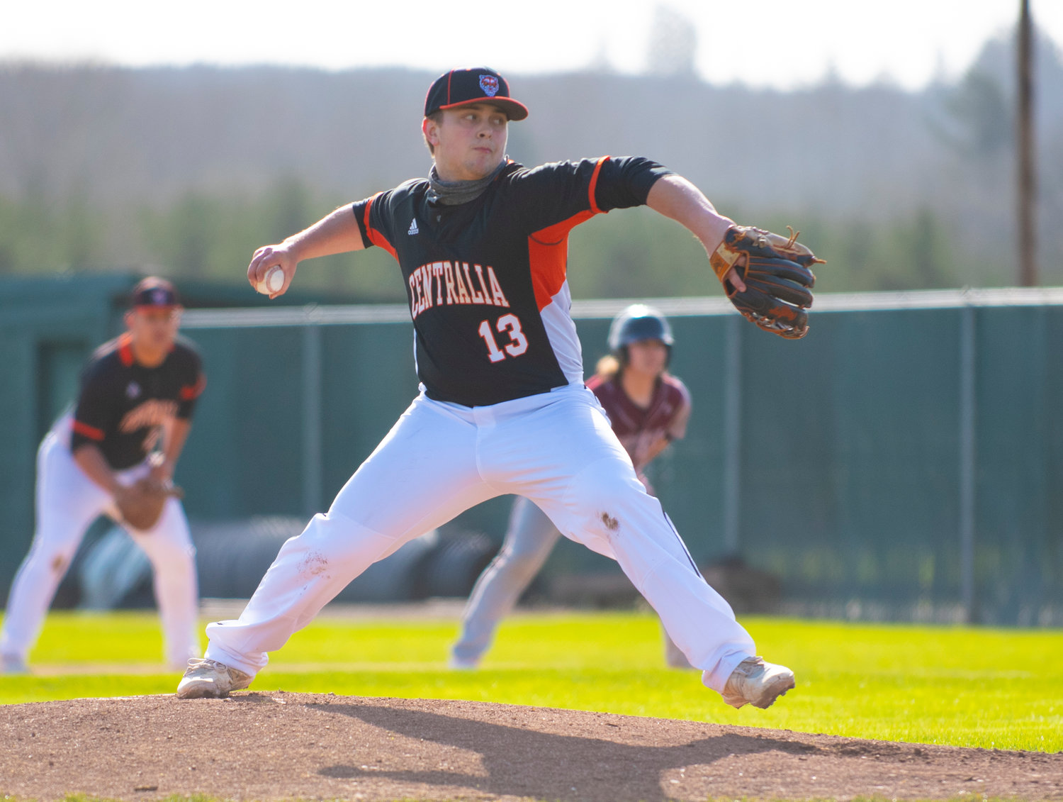 Centralia senior Cameron Erickson delivers a pitch to Montesano during the Tigers' season opener at home Monday.