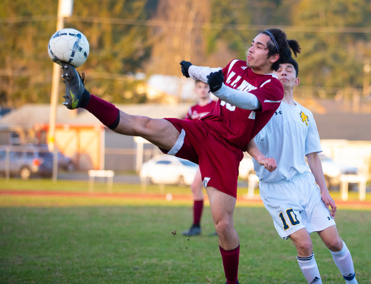 W.F. West junior defender Isaac Madrigal smashes the ball during the season opener on Tuesday against Aberdeen.