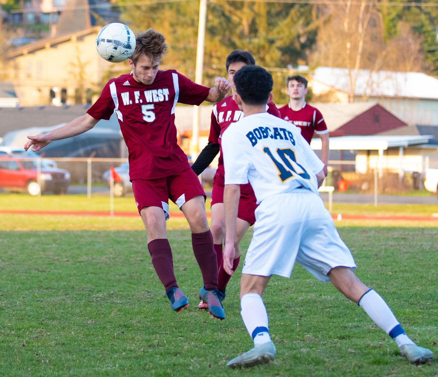 W.F. West's Jacob Moeckel (5) gets a header against Aberdeen on Tuesday.