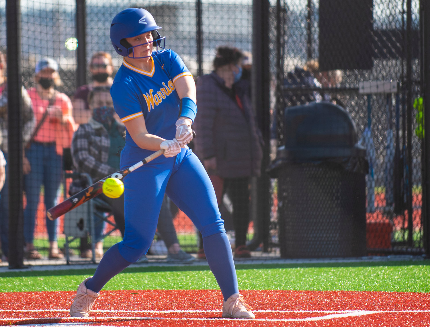 Rochester's No. 11 swings at a W.F. West pitch during the Warriors' road matchup on Wednesday.