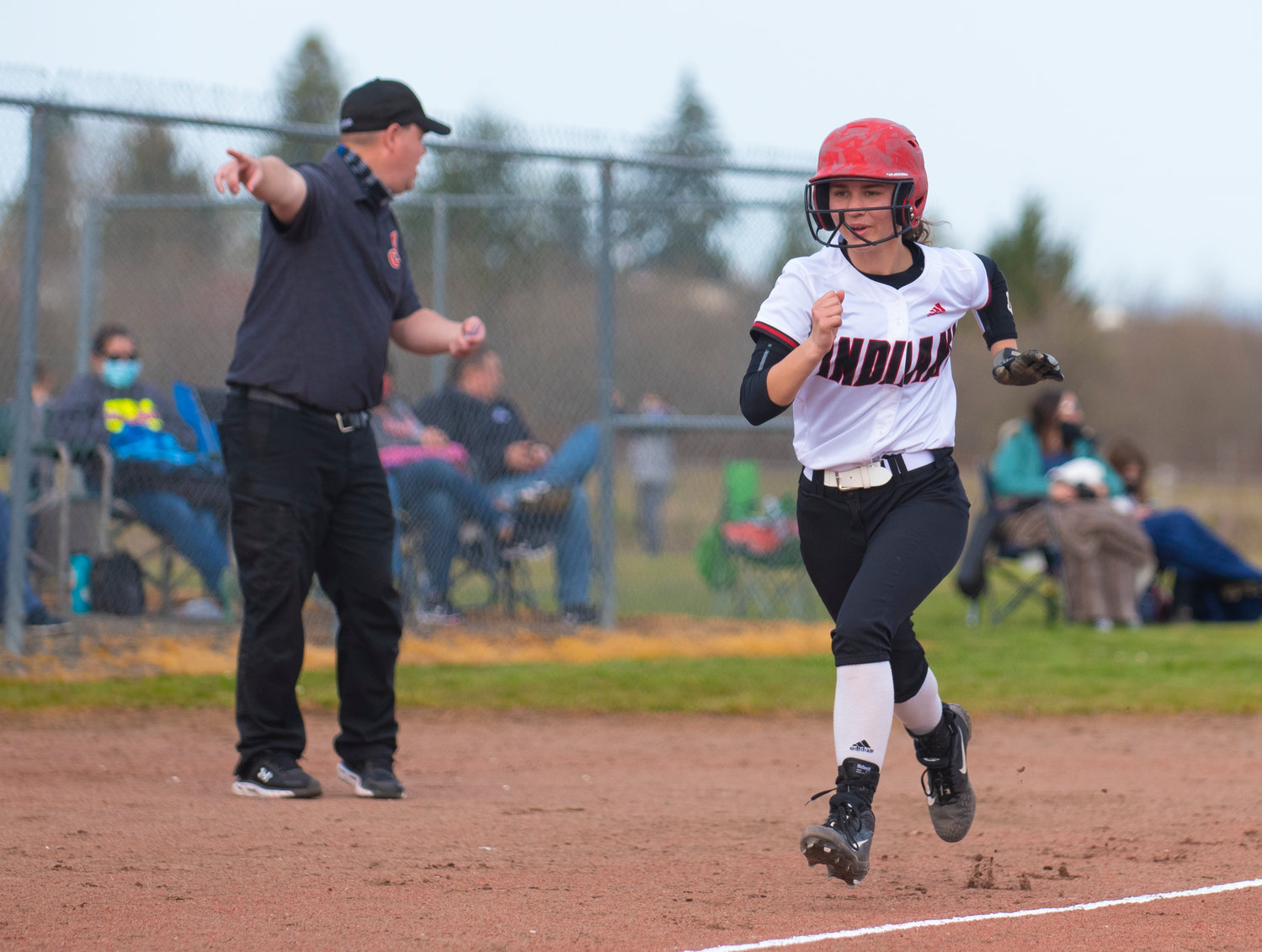 Toledo's Quyn Norberg races home to score a first-inning run against Wahkiakum on Thursday.