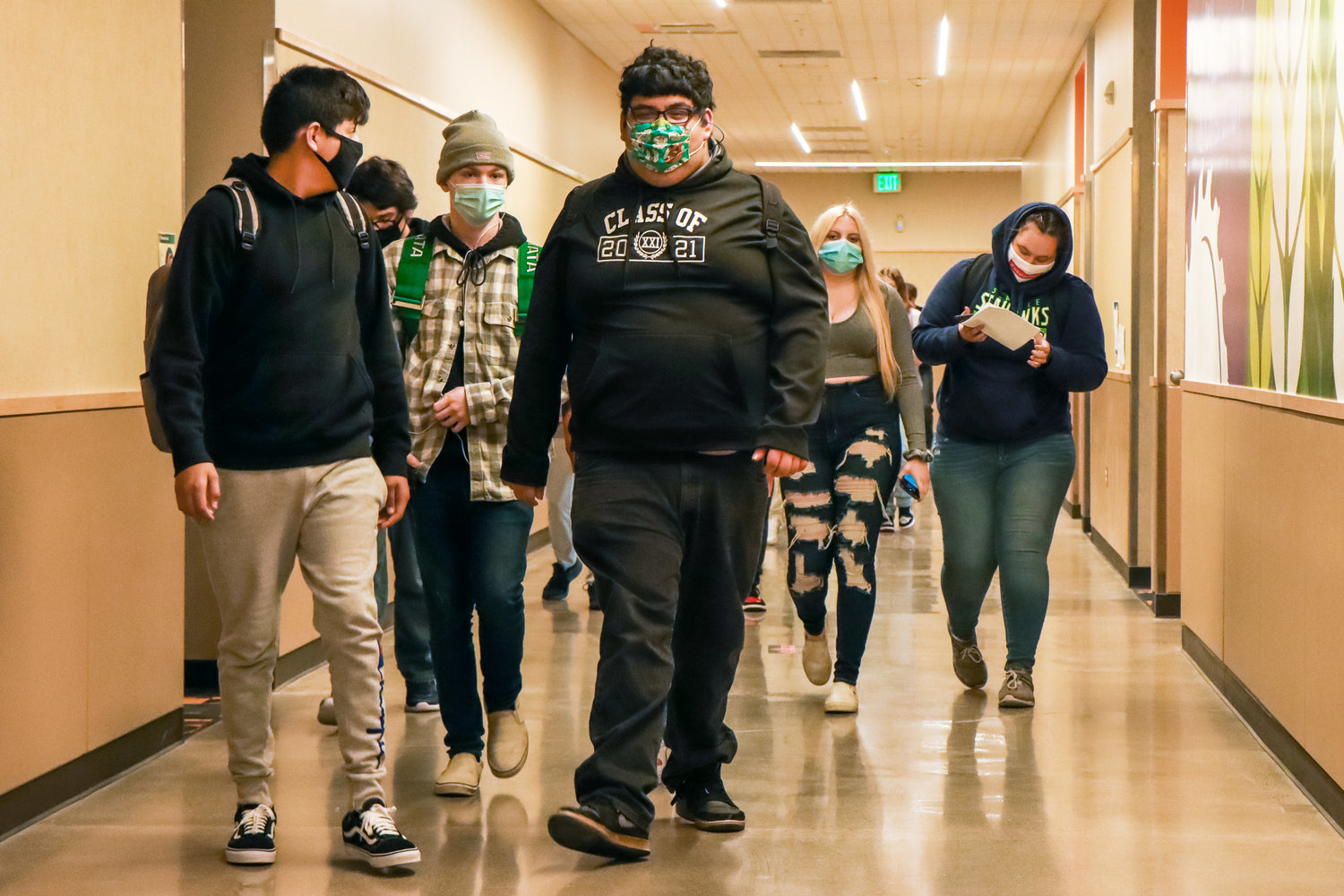 FILE PHOTO — Students sport masks as they walk to their classes during their first week back in school at Centralia High School in March.