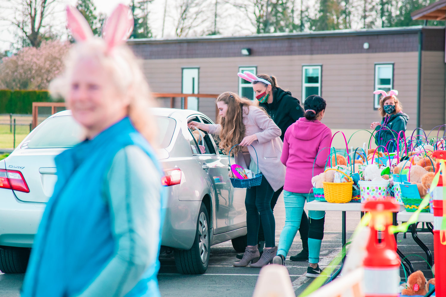 Easter baskets are loaded into cars for kids at Bethel Church on Saturday.