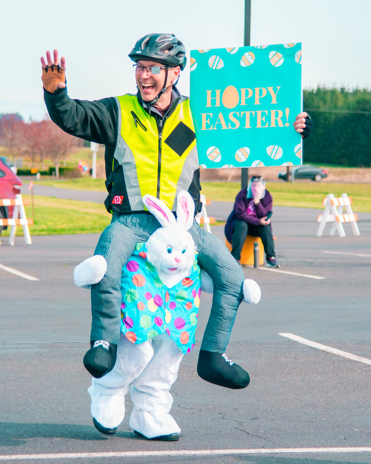 Pastor Kyle Rasmussen smiles and waves to visitors during an Easter event at Bethel Church in Chehalis on Saturday.