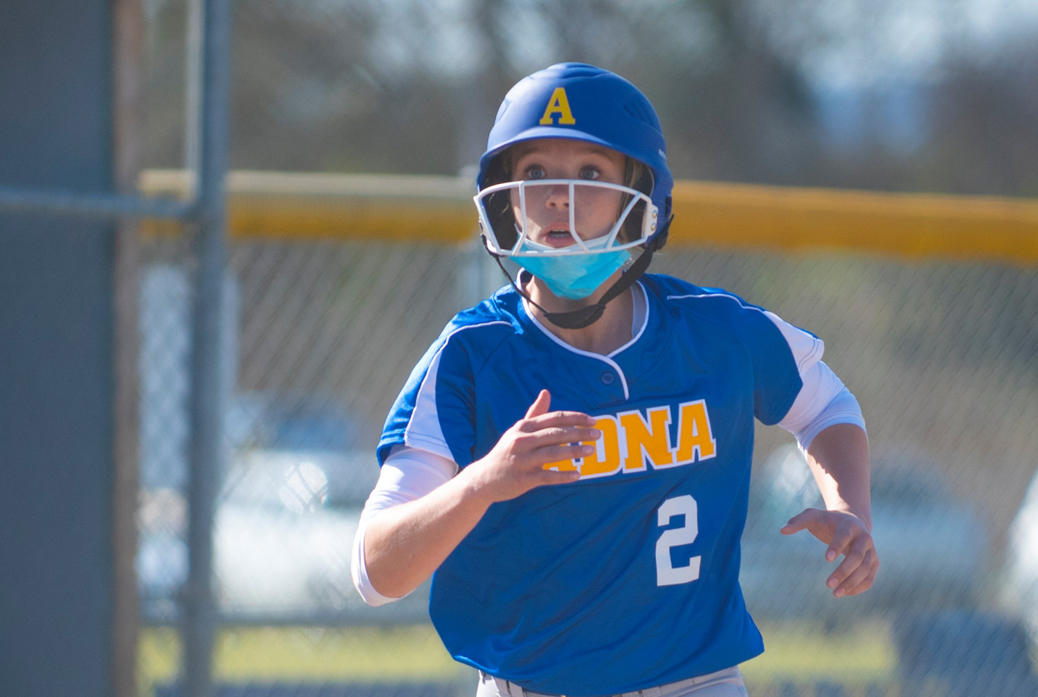 Adna's Ava Simms sees the throw at the plate while running home in the first inning against Toledo on Monday.