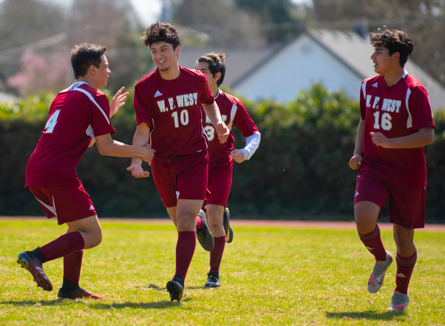 FILE PHOTO - W.F. West senior forward Antheny Mendez (10) is congratulated after scoring against Rochester on Tuesday.