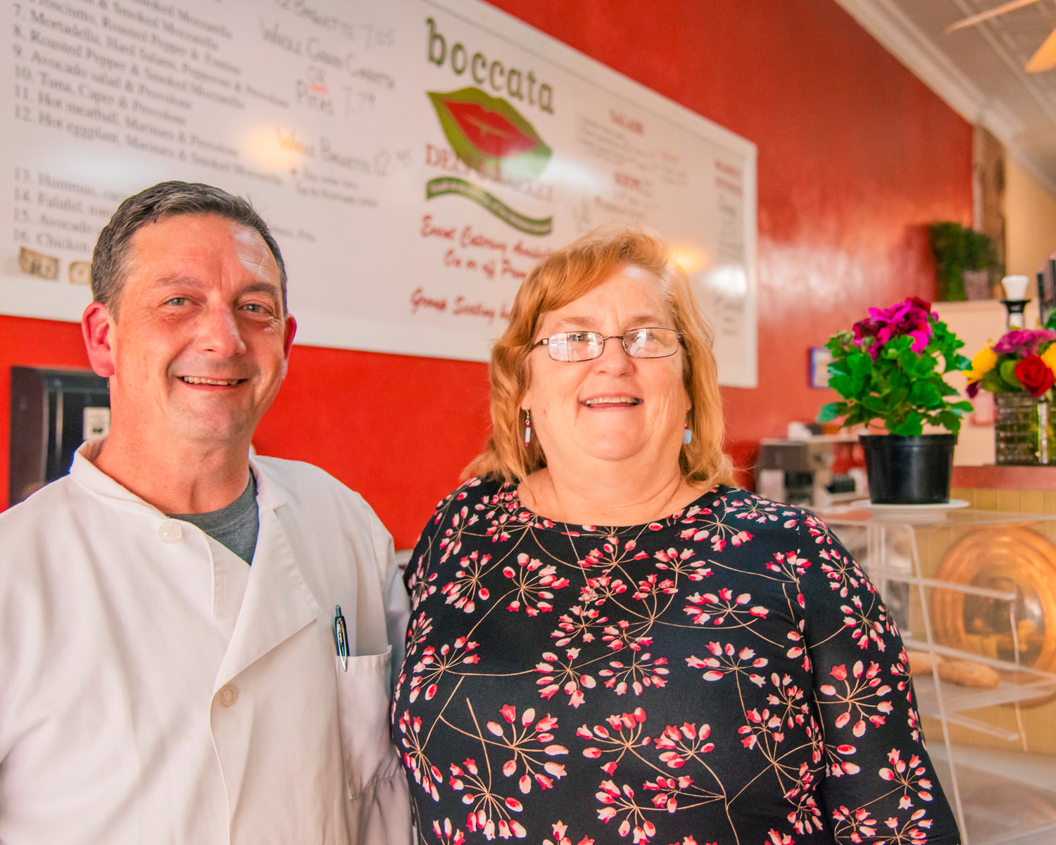 Darin and Kim Harris smile and pose for a photo inside the Boccata Restaurant in Centralia on Friday.