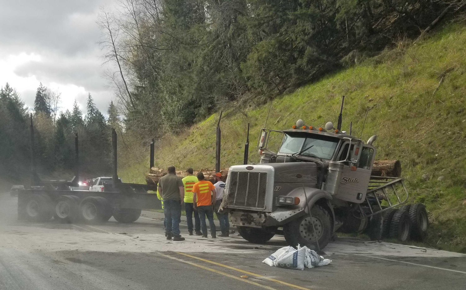 A jackknifed log truck collision shut down both lanes of U.S. Highway 12 at milepost 81 near Filbert Road Thursday afternoon. 