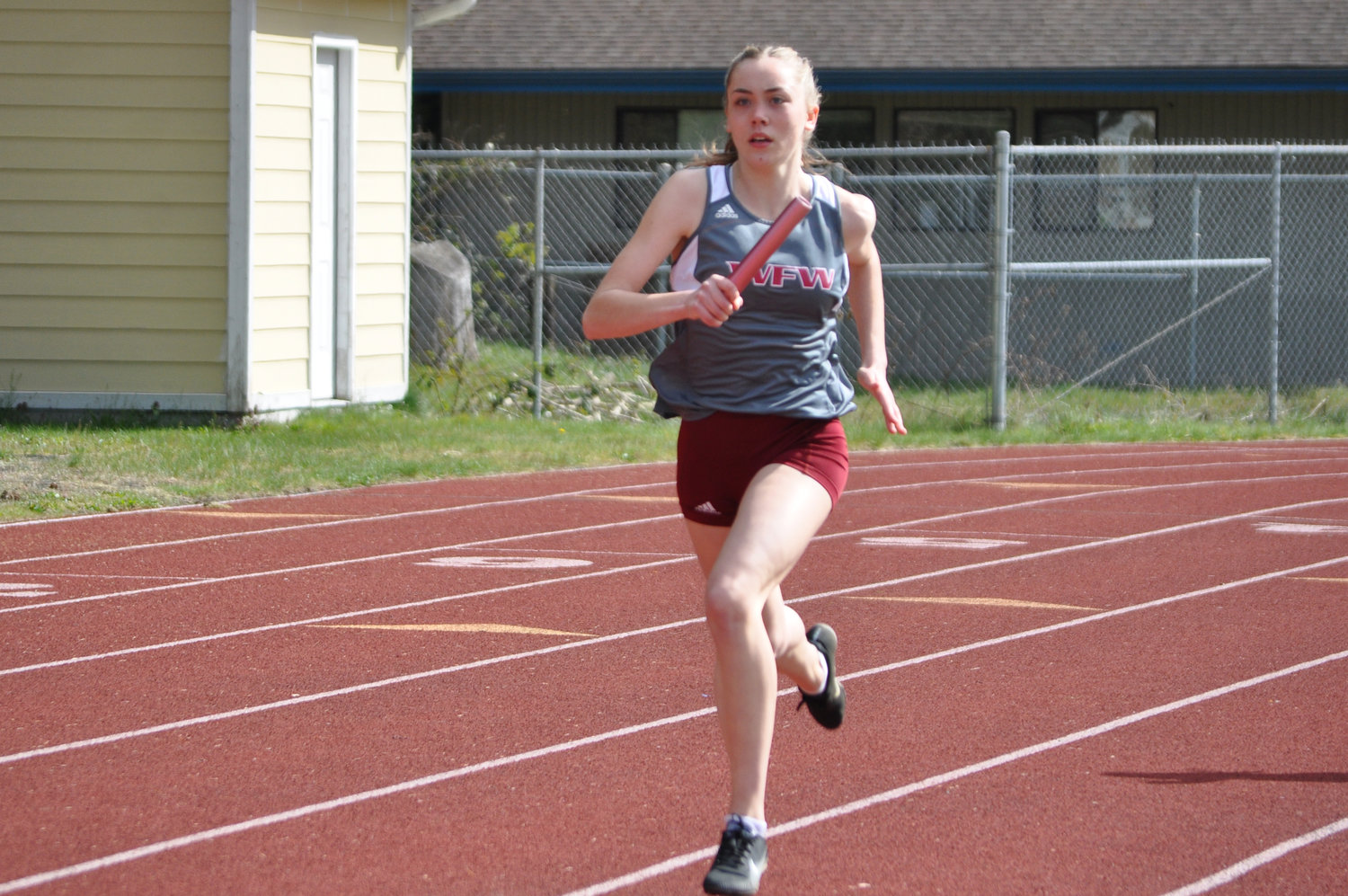 W.F. West's Brenna Witchey runs a leg in the girls 4x200-meter relay on Thursday at Shelton.