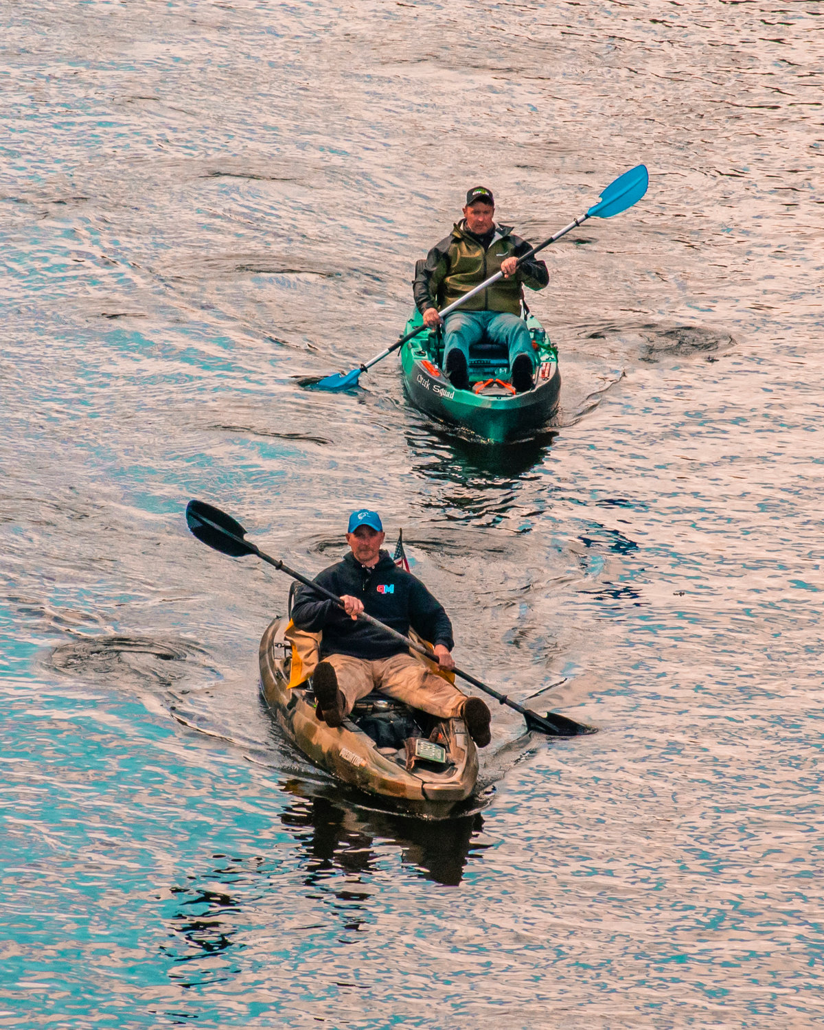 Kayakers use paddles as they make their way down the Chehalis River during the Pe Ell River Run on Saturday.