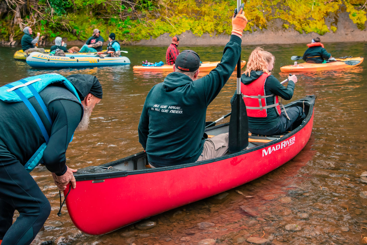 Jim Merrill helps attendees launch into the Chehalis River during the Pe Ell River Run on Saturday.