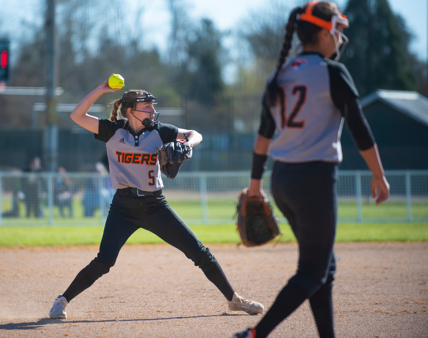 Centralia shortstop Lauren Wasson (5) makes a throw to first base after fielding a grounder on Monday.