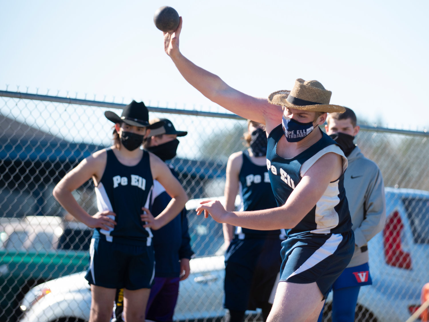 Pe Ell's Owen Little dons a straw hat while tossing the shot put Tuesday in Adna.