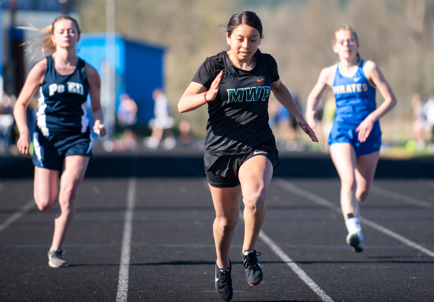 Morton-White Pass' Amy Martinez sprints in the girls 100-meter dash on Tuesday in Adna.