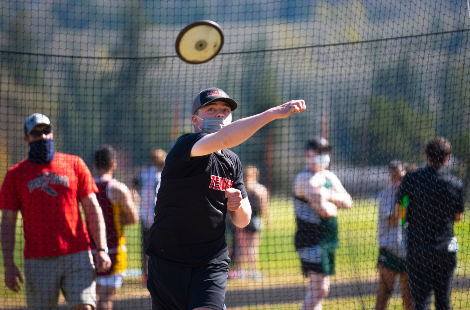 Tenino's Nolan Watson unleashes a discus throw on Thursday in Mossyrock.
