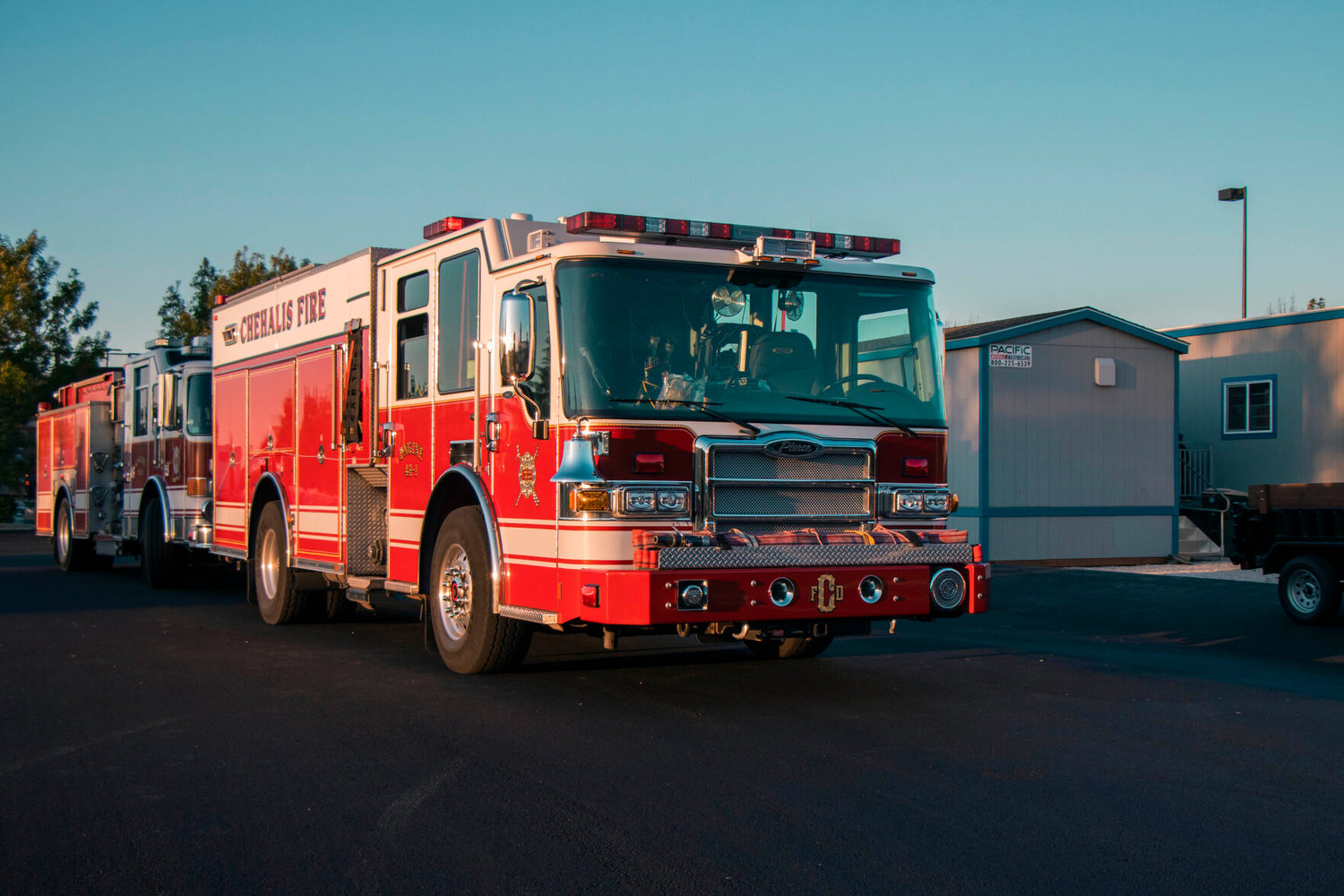 FILE PHOTO — Chehalis Fire Department engines are parked outside a temporary fire station in July 2020.