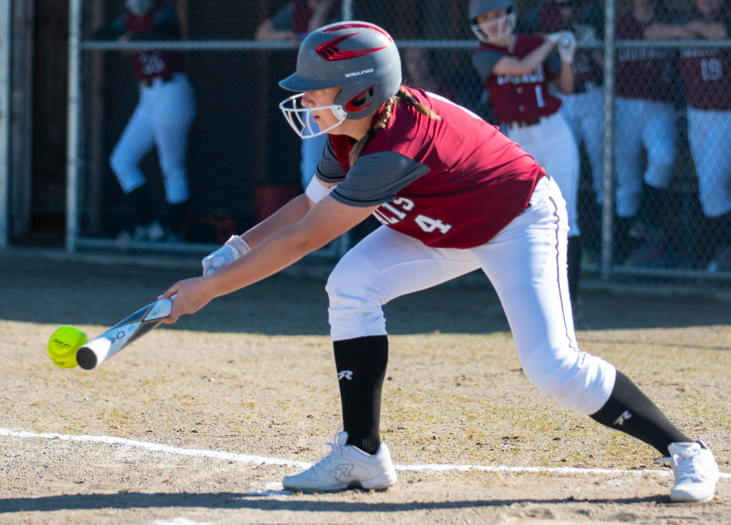 W.F. West's Lena Fragner lays down a bunt against Rochester on Friday.