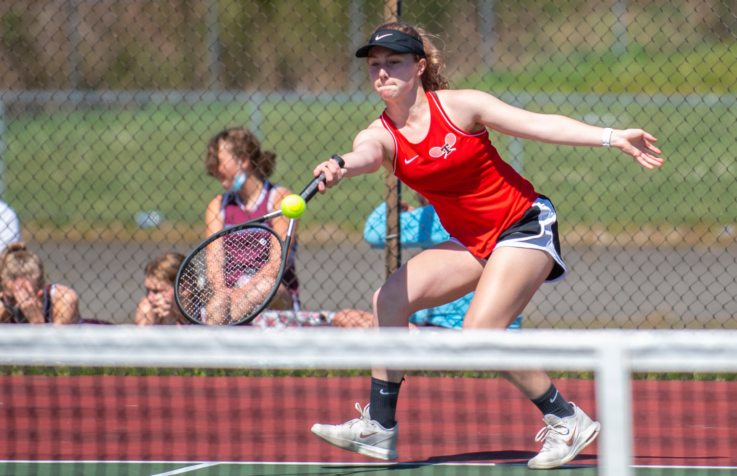 Tenino's Megan Letts battles a Stevenson player in the No. 1 singles match on Saturday in Tenino. Letts won the match, 4-6, 6-0, 6-3.