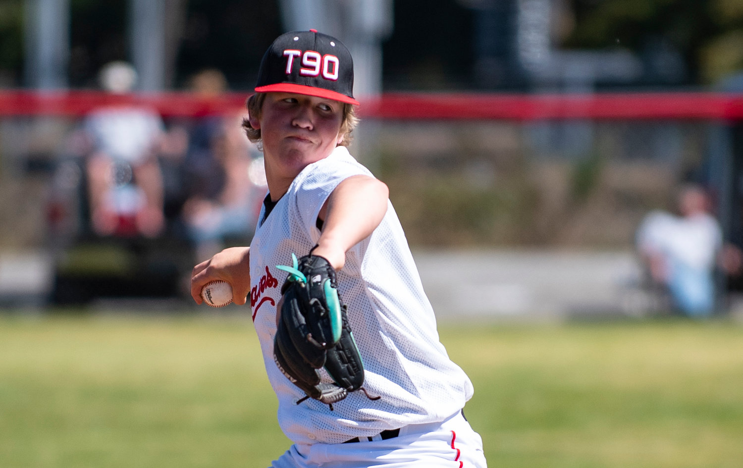 Tenino's Easton Snider winds up to deliver a pitch to a Hoquiam batter on Saturday.