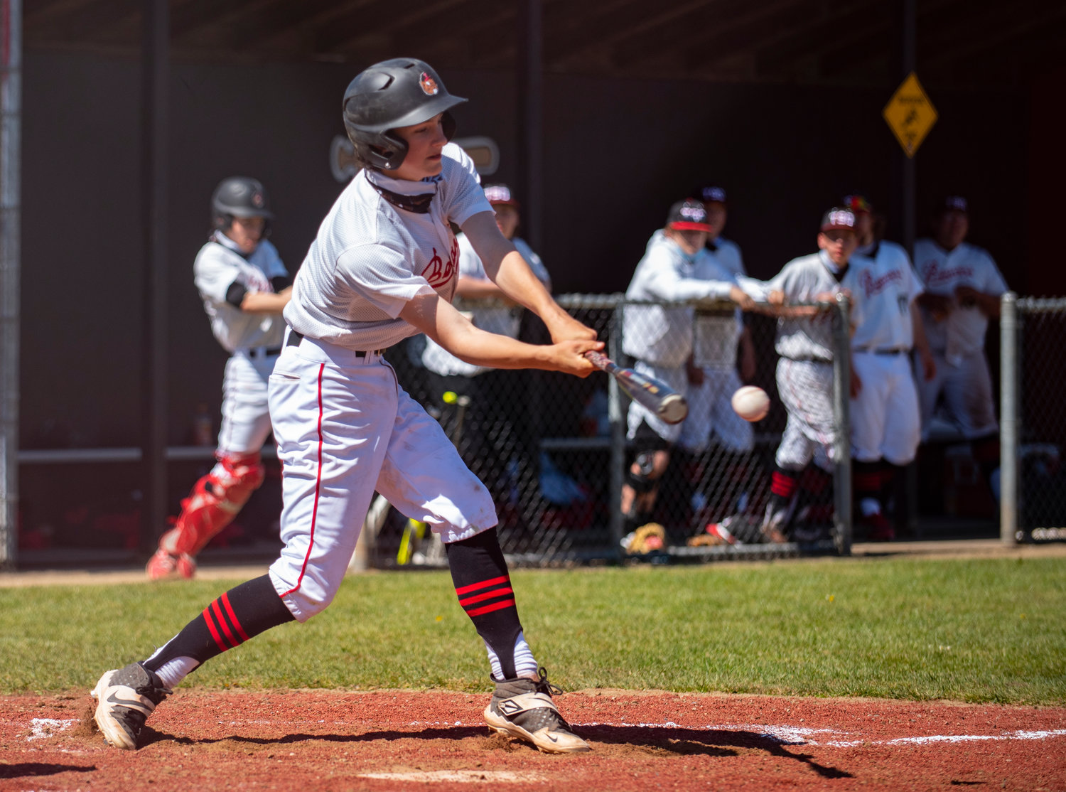 Tenino's Brody Noonan lines a Hoquiam pitch up on Saturday.