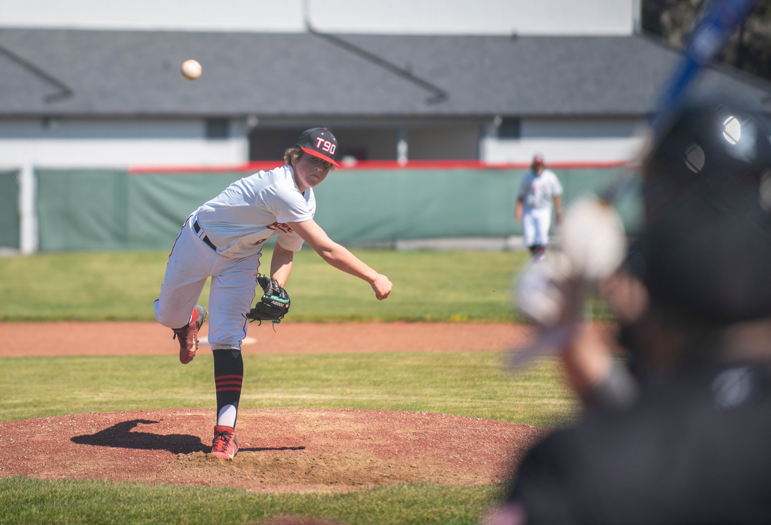 Tenino pitcher Easton Snider delivers a pitch to a Hoquiam batter on Saturday.