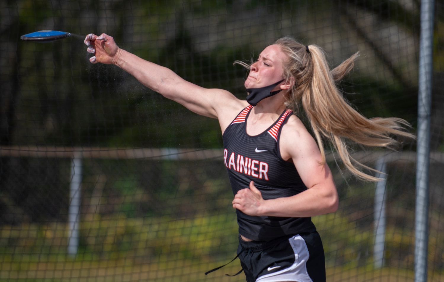 Rainier's Isabella Holmes launches the disc on Monday in Tenino.