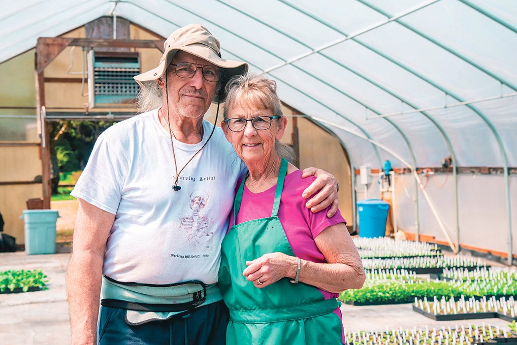 John Glasser and Thelma Hauge pose for a photo inside a greenhouse at the Blueberry Hill Nursery Tuesday afternoon in Vader.