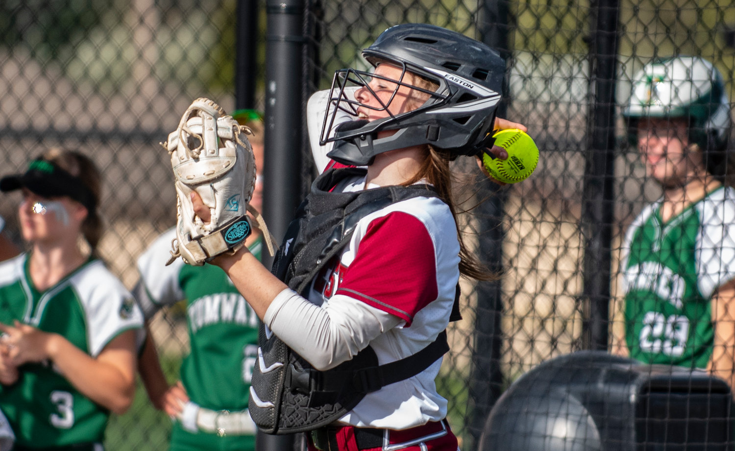 W.F. West's catcher makes a throw back to the circle on Wednesday.