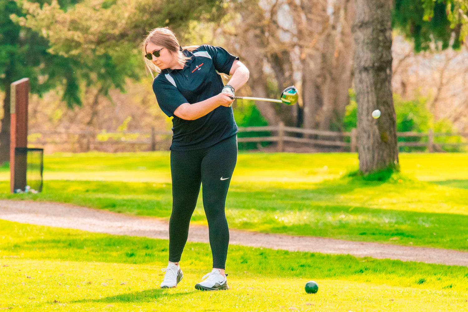 Centralia’s Lily Miller swings her club at Riverside Golf Course in Chehalis.