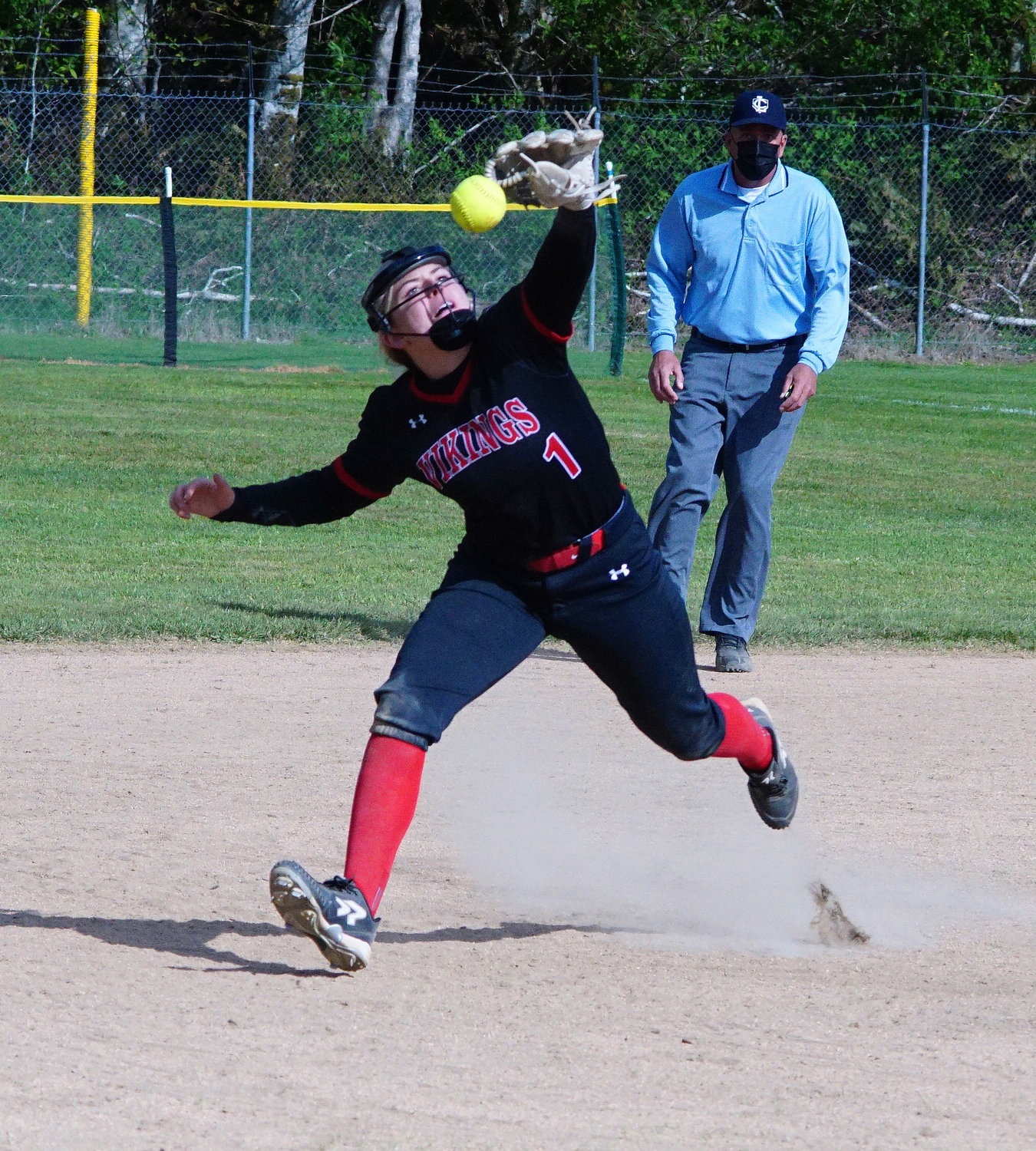 Mossyrock shortstop, Gracie May West, just misses stopping a hard line drive in late game action  of the first game of a double header against Naselle on Thursday.