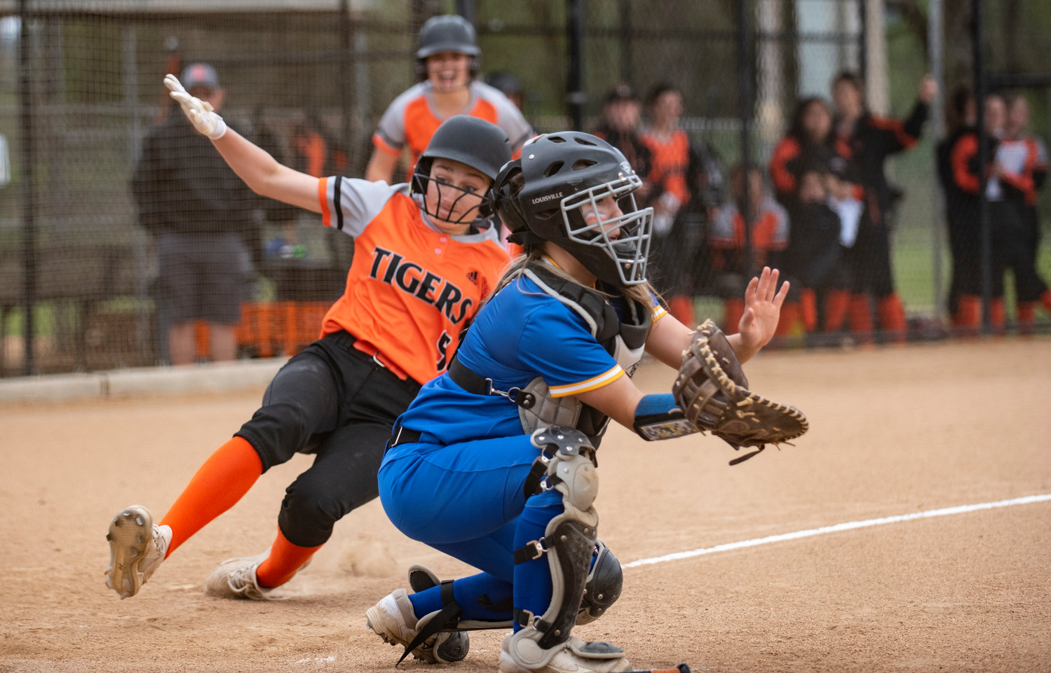 Centralia's Lauren Wasson slides safely into home plate on Friday.