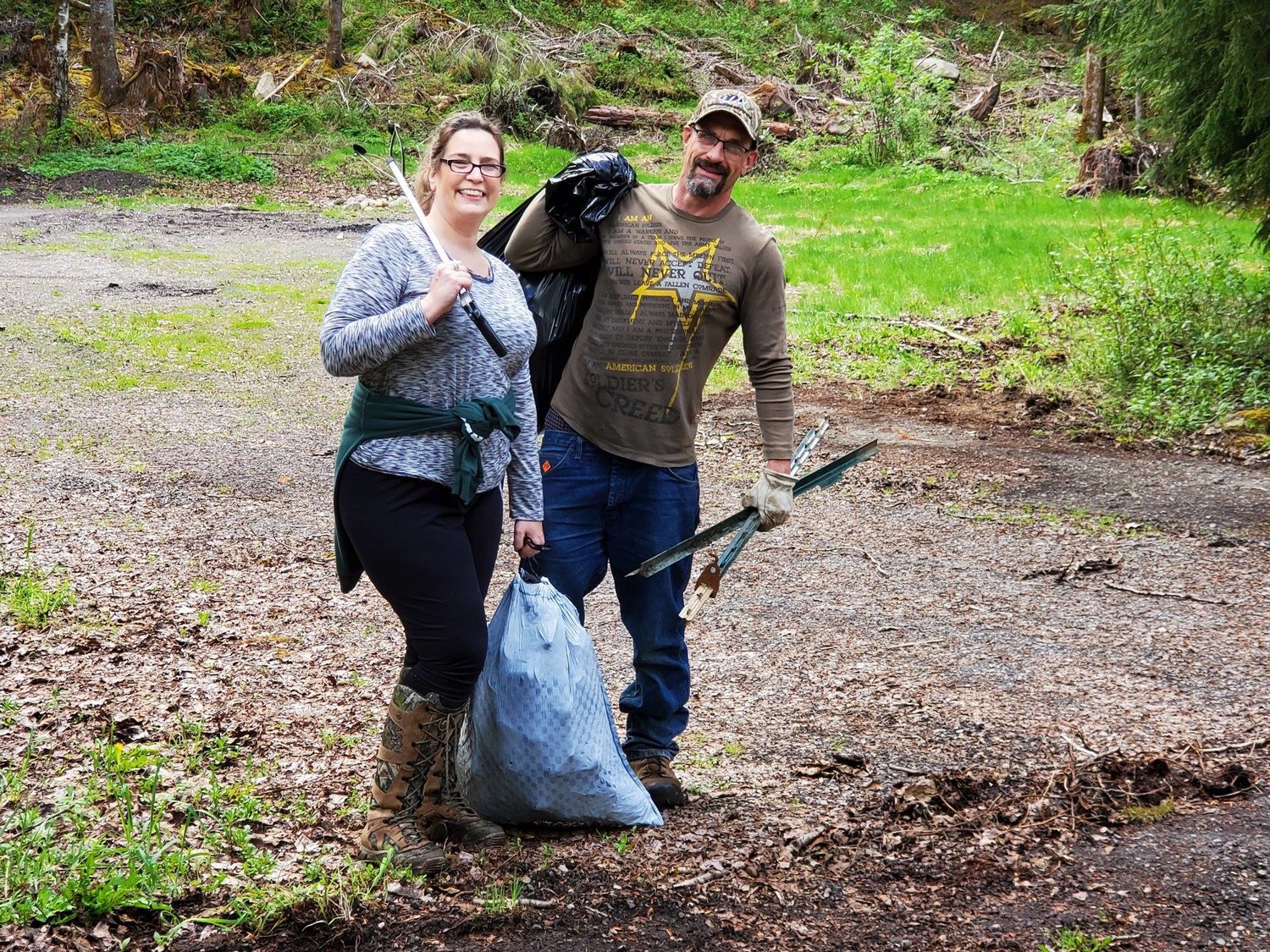 Husband-wife duo Lisa Balkwill and Gene Balkwill pose for a photo during a cleanup hosted by Gifford Pinchot Trash Force cleanup group.