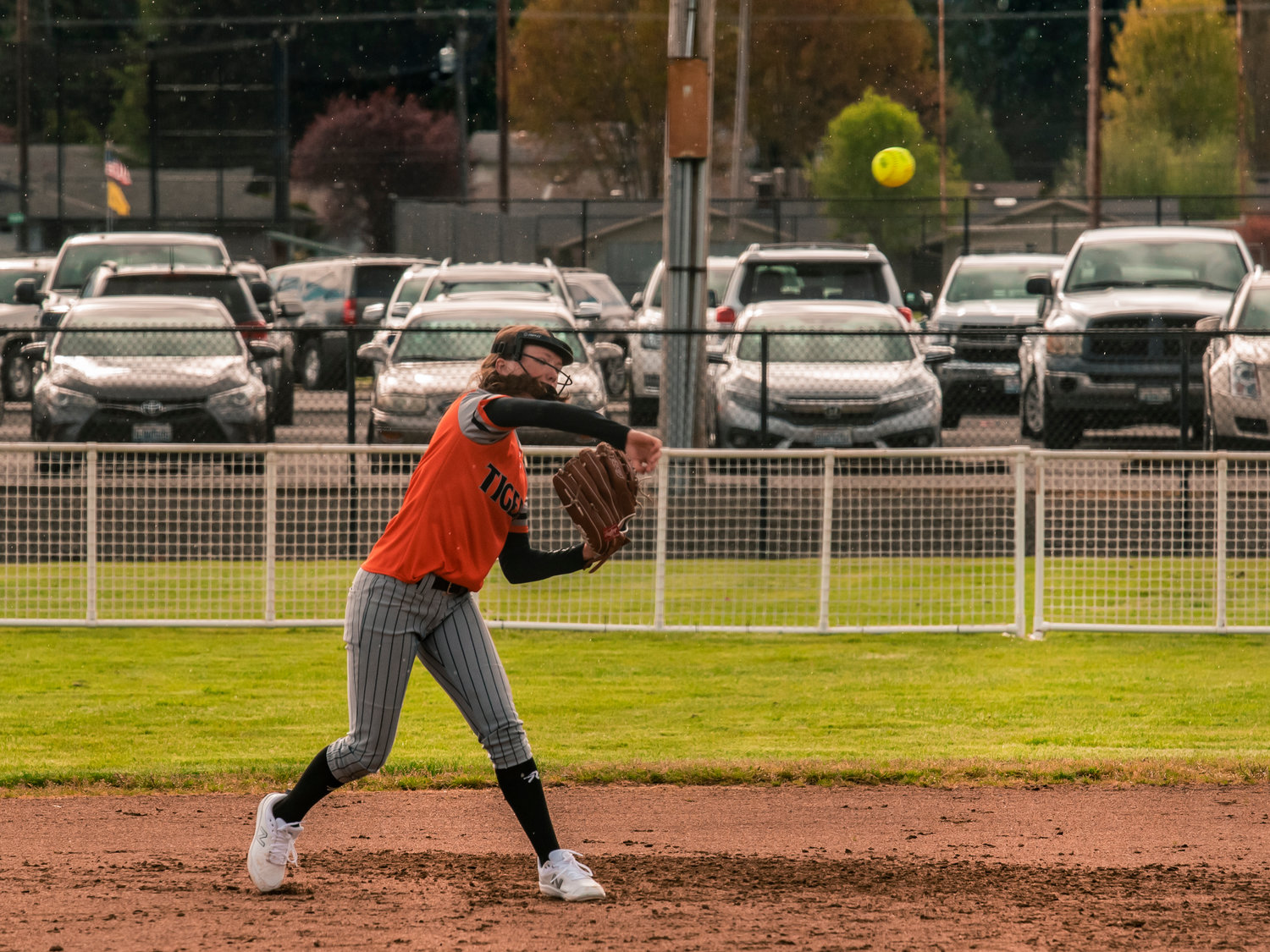 A Centralia infielder makes a throw to first base after fielding a grounder.