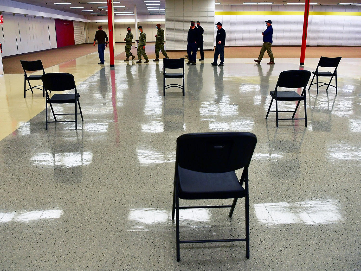 Chairs are carefully placed and distanced on Tuesday, April, 27, in preparation for Wednesday’s Public Walk-in Covid-19 Vaccine Clinic to be held in the former Sears location in the Lewis County Mall. A variety of local officials toured the site on Tuesday to ensure its readiness for the clinic, which will be staffed by members of the Washington Army National Guard.
