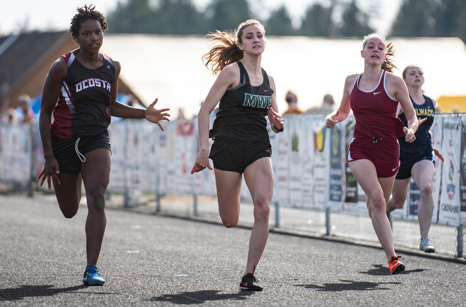Morton-White Pass junior Jordan Koetje, middle, placed second in the girls 100-meter dash at the district championships Thursday.