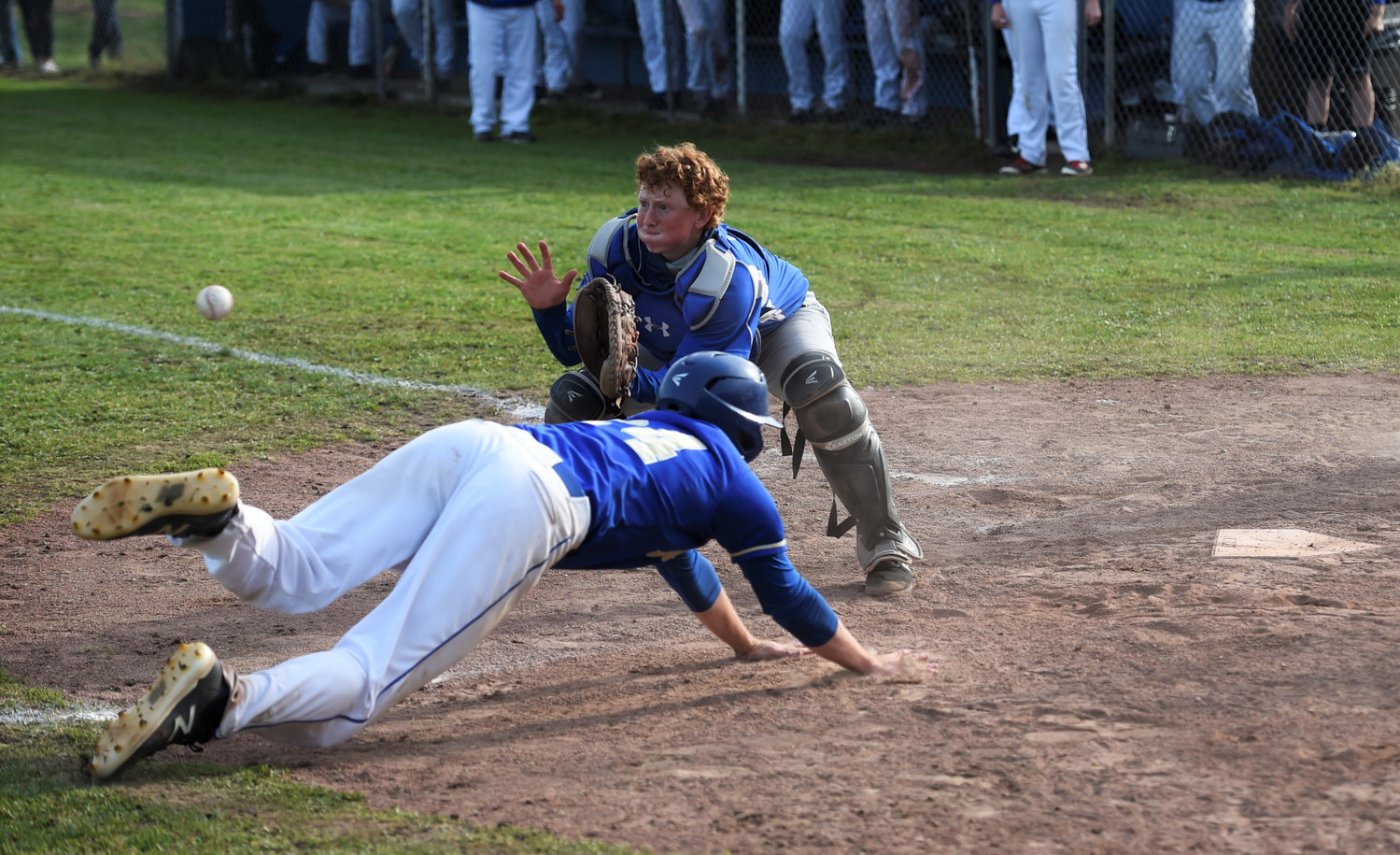 Adna senior Levi Gates slides head-first into home plate against Toutle Lake in the district semifinals on Thursday in Toutle.