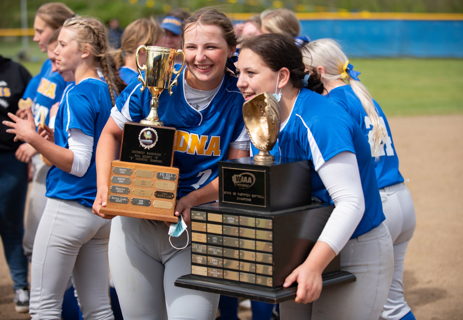 Haley Rainey, left, holds the district championship trophy and Kaylee Ashley holds the 2019 state championship trophy.