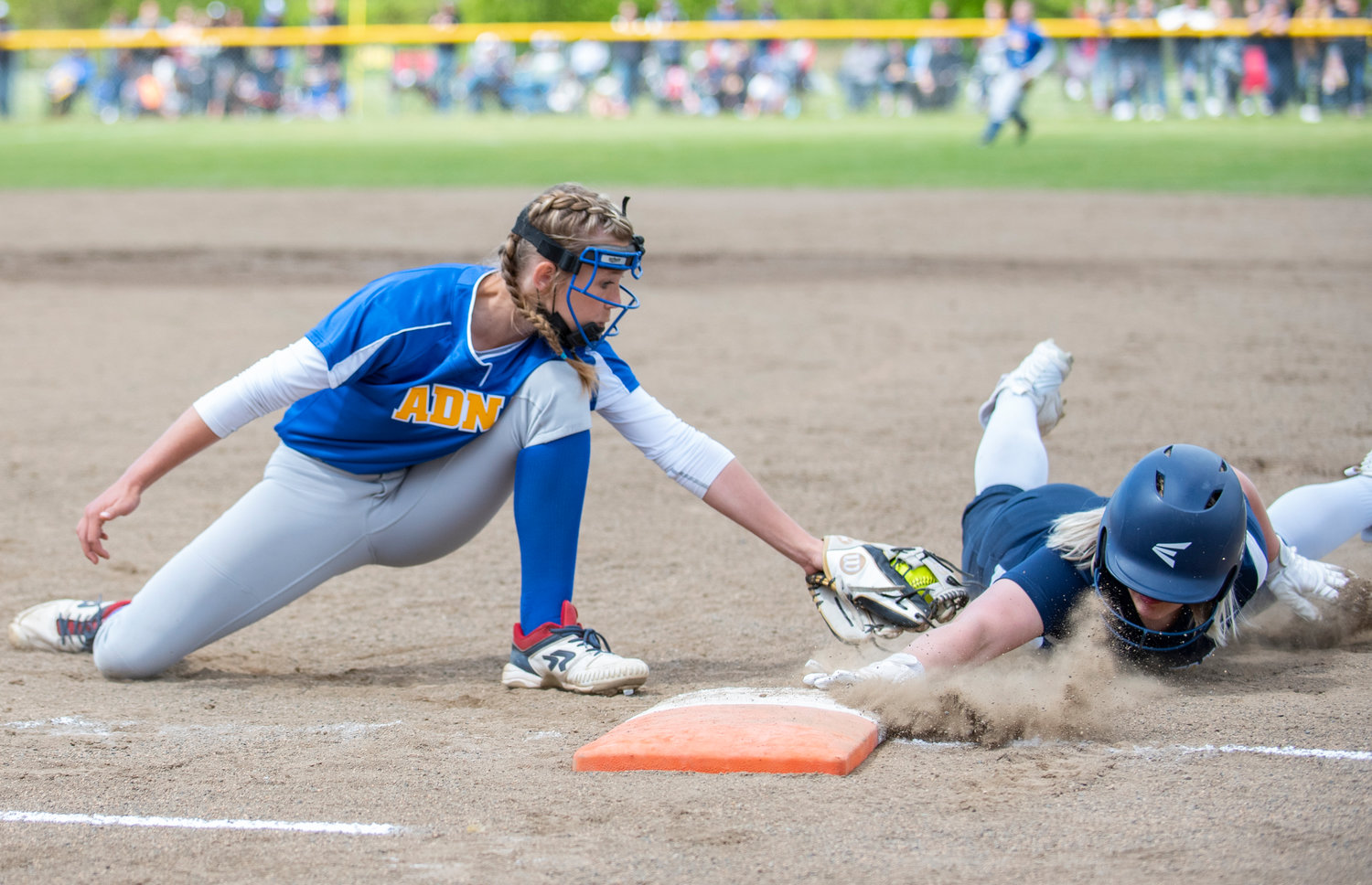 Adna first baseman Ava Simms goes for the tag on a pickoff attempt Saturday.