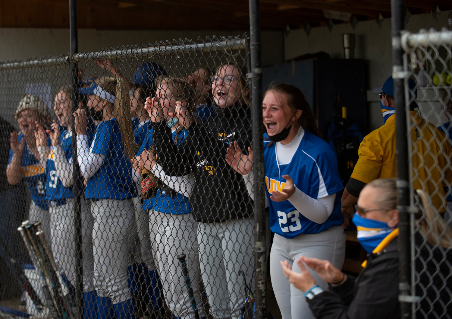 Adna's dugout cheers after Karlee Von Moos smacks an RBI triple to put the Pirates up 1-0 in the fourth inning.