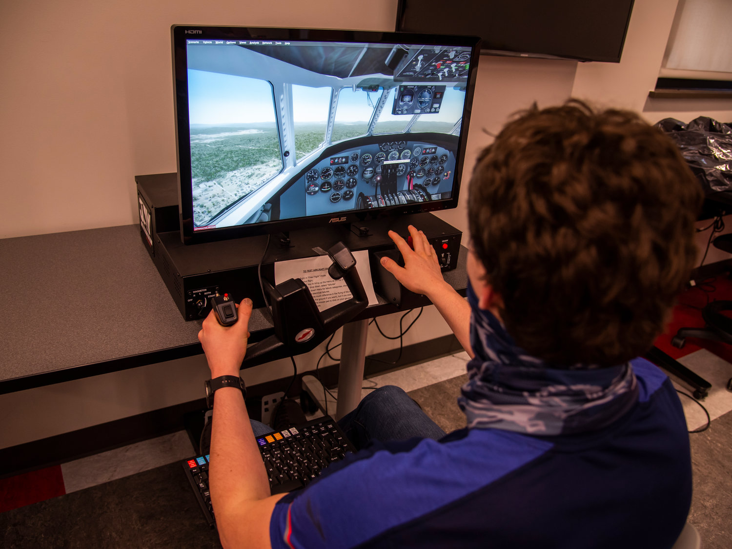 WF. West student Henry Jordan shows off one of the school’s flight simulators.