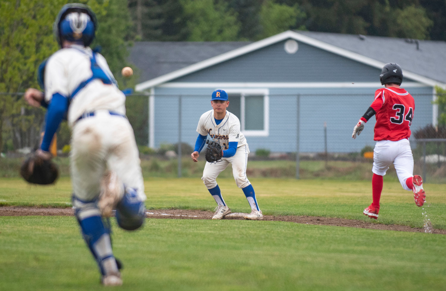 Rochester catcher Cody Morton throws out a Shelton runner at first base with a toss to Eddie Burkhardt.