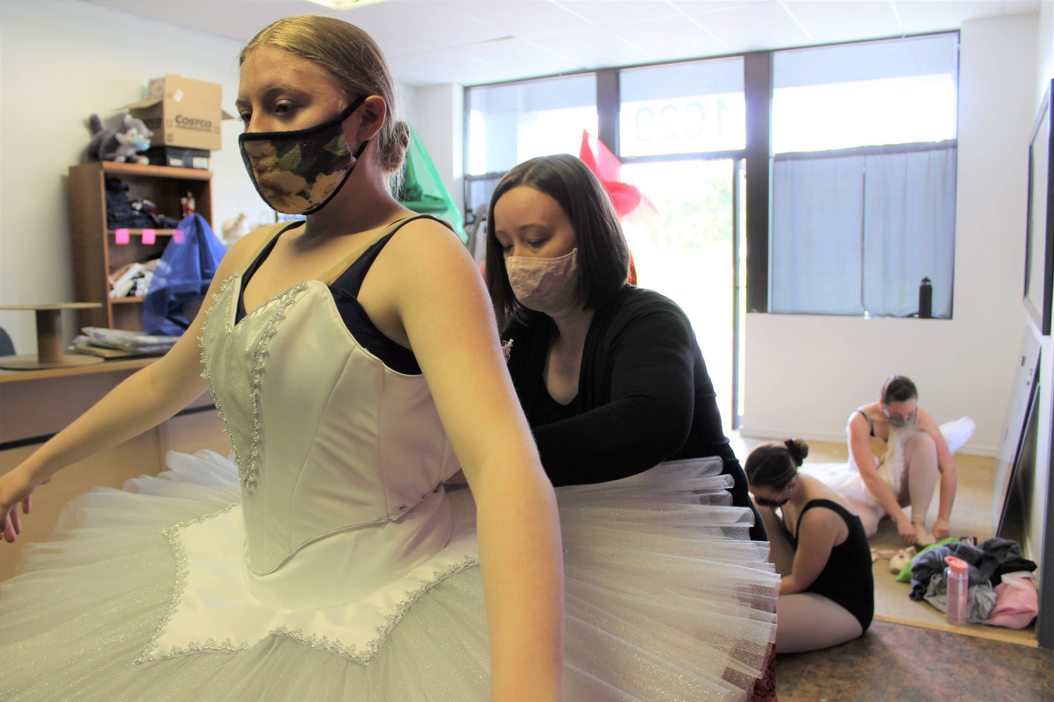 McKenna Bryan, 13, gets fitted for her Silver Jewel Fairy costume by volunteer Emily Smith at Centralia Ballet Academy. The local ballet company will be presenting two performances of "Sleeping Beauty" May 16 and June 5, the first live performance for the studio in more than a year.